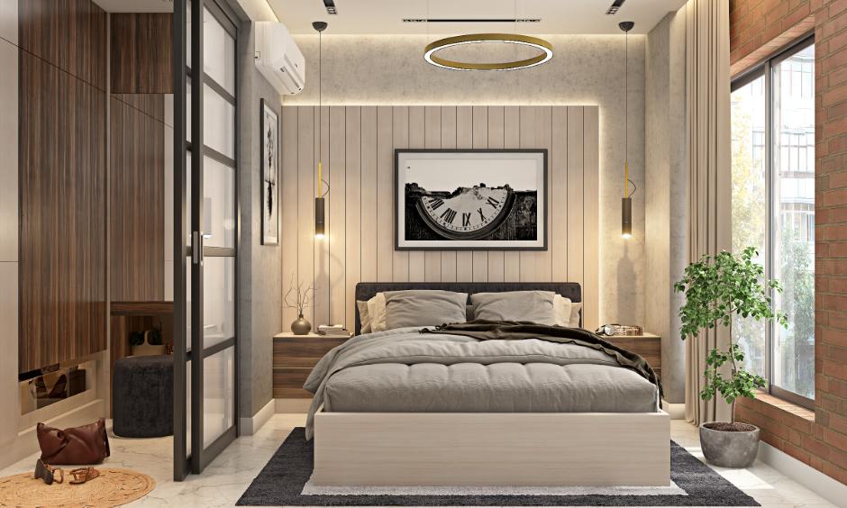 Cosy grey bedroom with contemporary furniture and warm lighting.