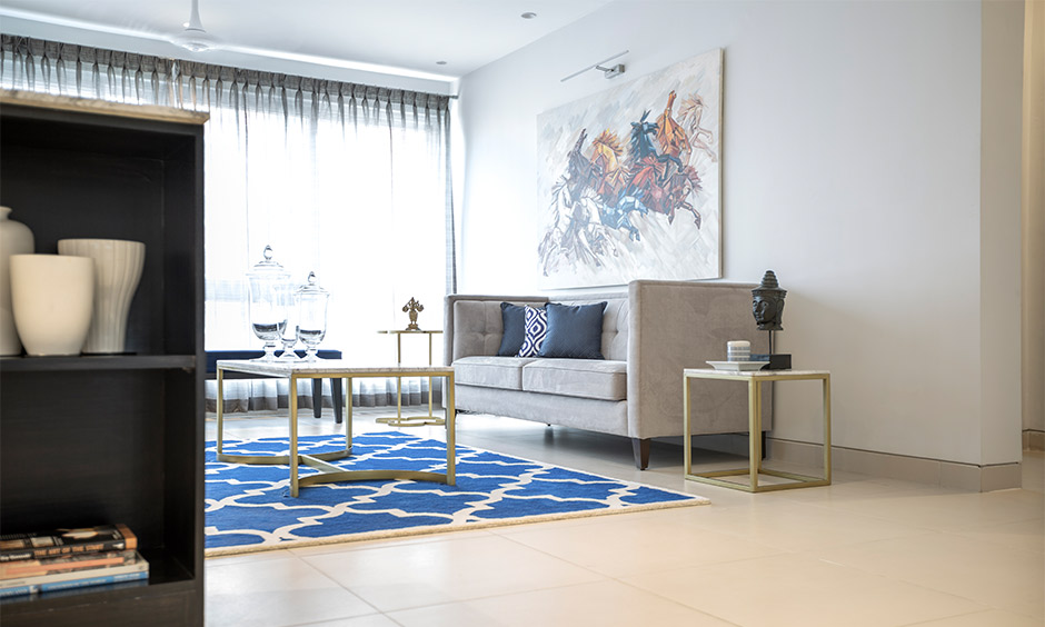 Artists' inspired grey and blue living room which maximises natural light