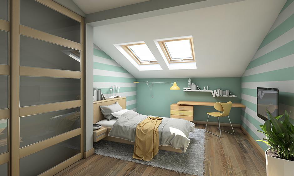 A small, irregularly shaped bedroom design which highlights the bedroom’s best features