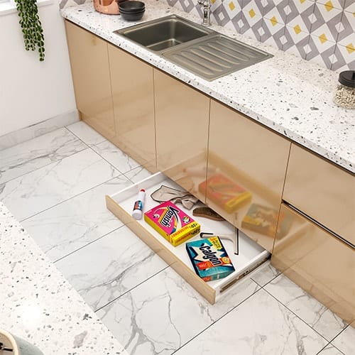 Home interior designer in Delhi created a skirting drawer that utilizes the dead space