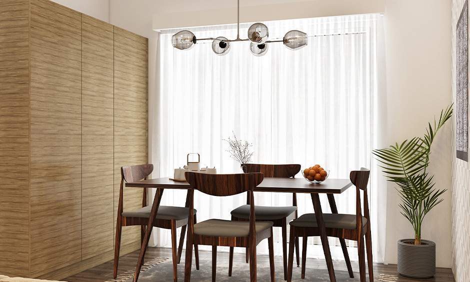 Dining room with elegant off-white wall painting, enhancing natural light and minimalist decor.