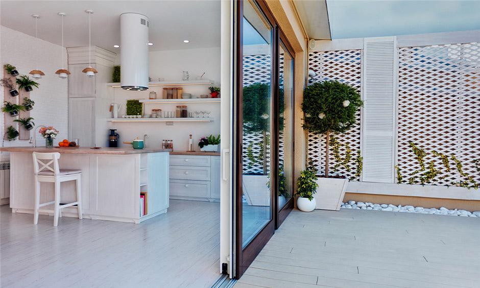 Sliding glass door connecting kitchen to outdoor space for natural light and smooth flow