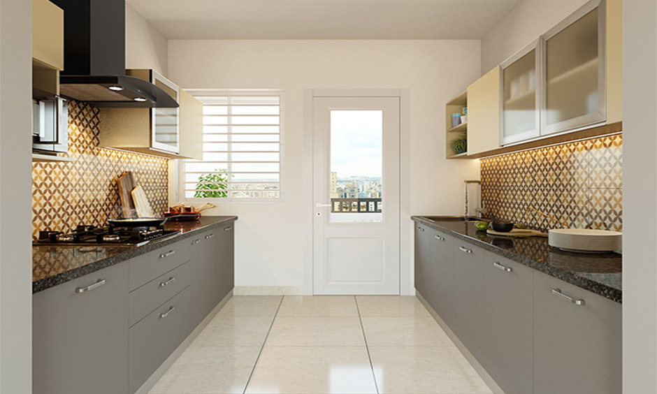 Wet and dry kitchen with sliding glass divider creating separation while keeping the space bright and airy.